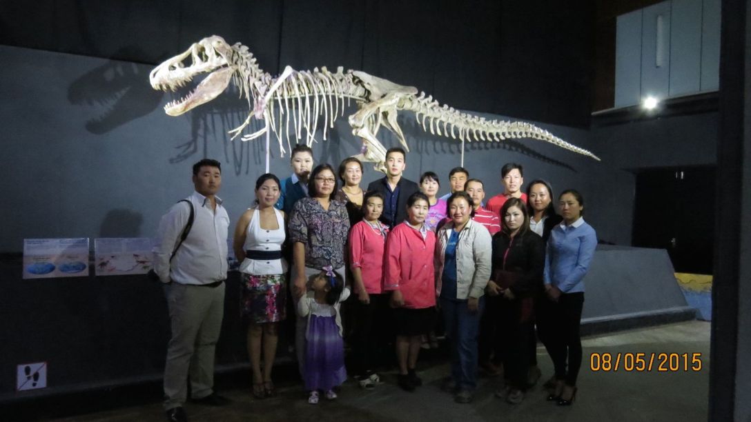 Bolor's colleagues in Mongolia pose with the Torbosaurus bataar specimen that was recently returned to its county. Photo courtesy of Bolor Minjin.